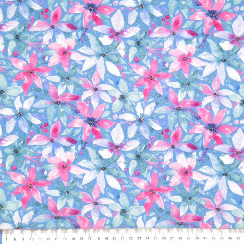 Pink flowers printed on a blue linen viscose mix fabric with a cm ruler