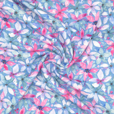 Pink flowers printed on a blue linen viscose mix fabric in a swirl