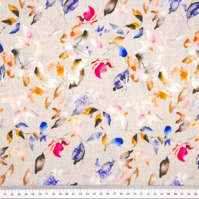 Pattern of colourful leaves on a textured dove linen fabric with a cm ruler