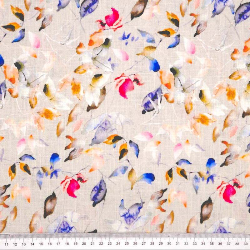 Pattern of colourful leaves on a textured dove linen fabric with a cm ruler