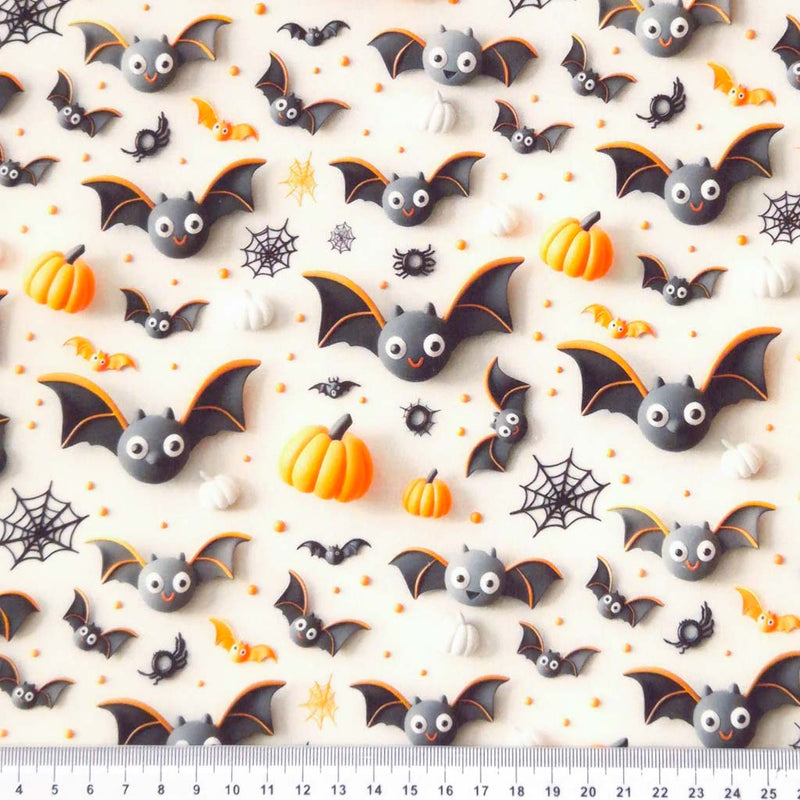 3D bats and pumpkins printed on cotton fabric by Little Johnny with a cm ruler