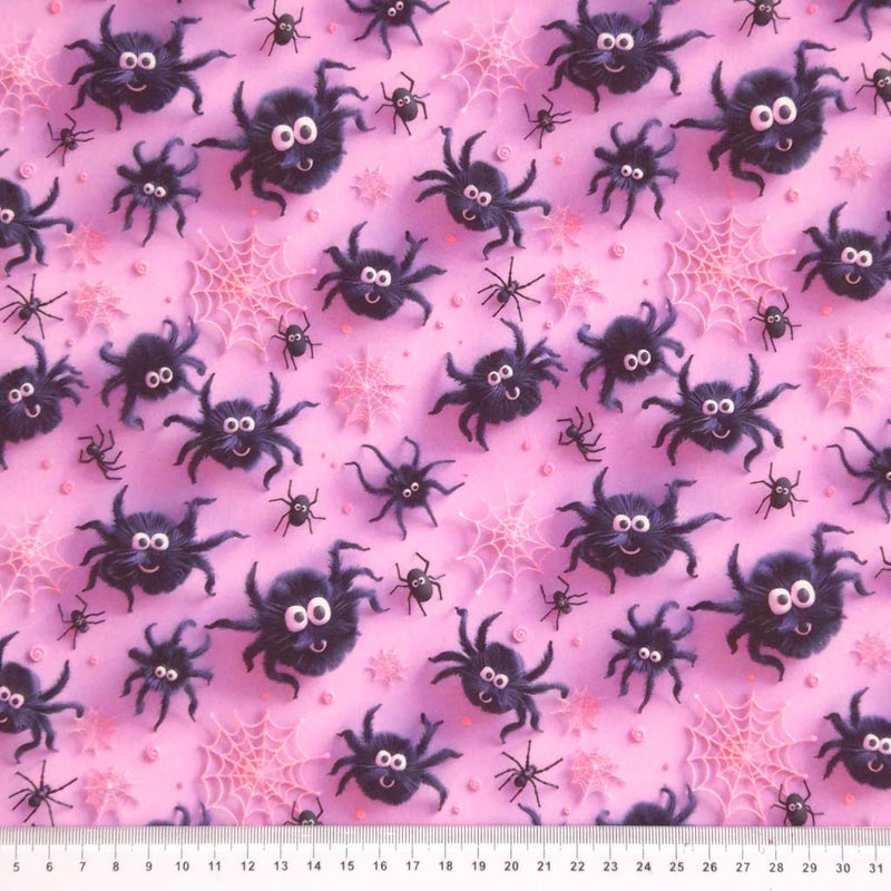 3D spiders printed on a pink cotton fabric by Little Johnny with a cm ruler