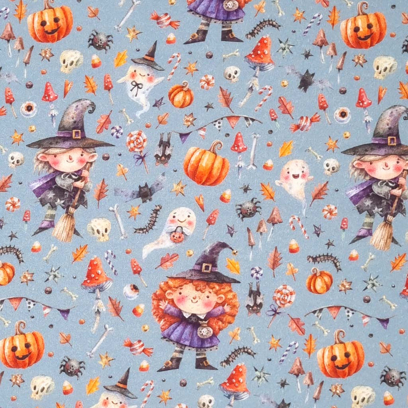 Witches and pumpkins are printed on a grey cotton fabric by Little Johnny