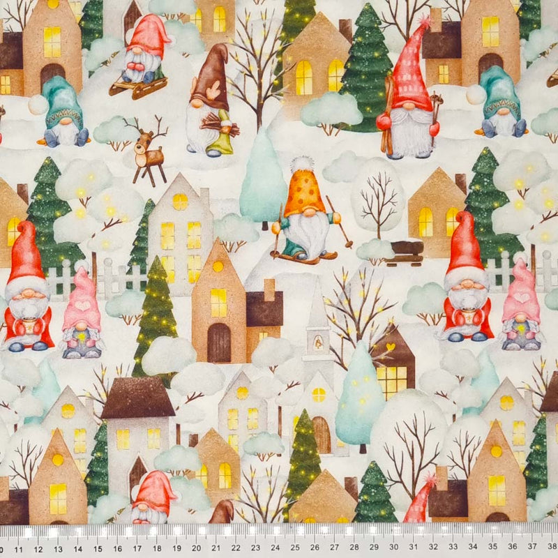 Fabric featuring gonks and reindeer in a festive little gonk town printed on an off white 100% quality cotton fabric by Little Johnny with a cm ruler