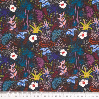 Feathers and fauna printed on a cotton fabric by Little Johnny with a cm ruler