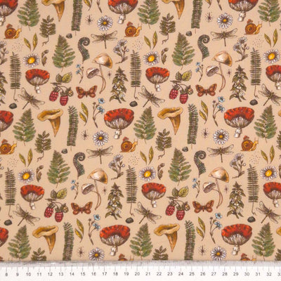 Forest scene printed on beige cotton fabric by Little Johnny with a cm ruler