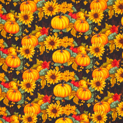 Pattern of pumpkins and sunflowers on a dark cotton fabric