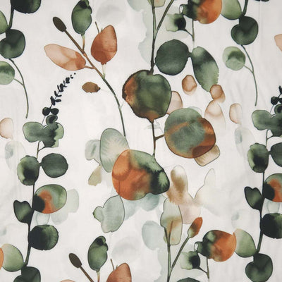 Pattern of green and brown leaves on a light viscose twill fabric