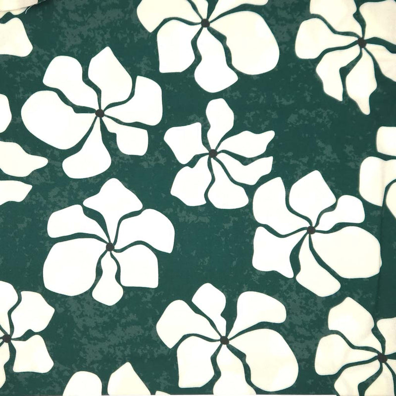 White floral pattern on a green textured viscose twill fabric