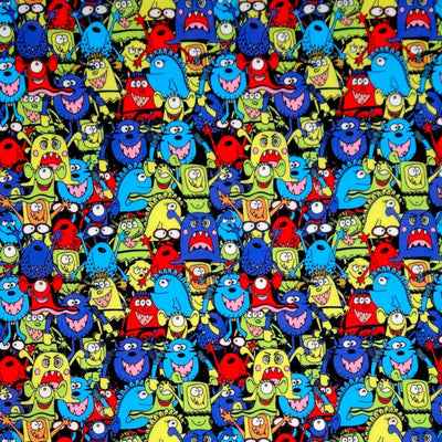 Pattern of colorful cartoon monsters on a black halloween polycotton fabric.