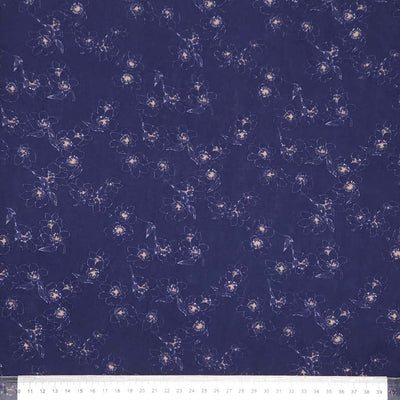 Floral pattern on a dark blue viscose with a ruler at the bottom.
