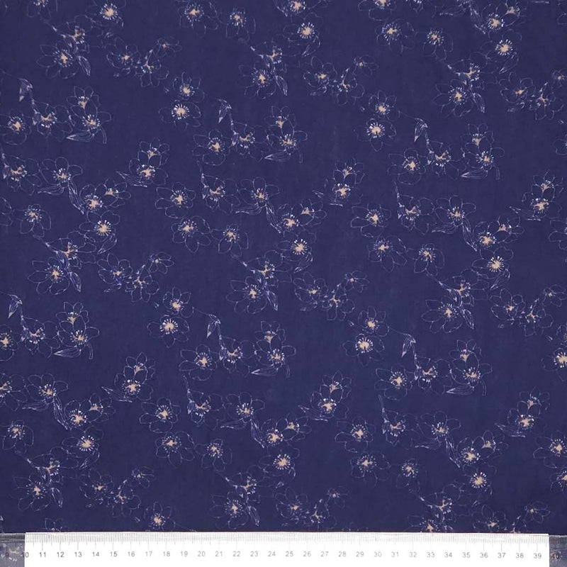 Floral pattern on a dark blue viscose with a ruler at the bottom.