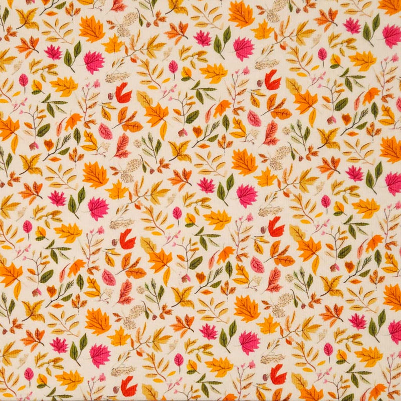 Pattern of autumn leaves and flowers on a beige needlecord fabric