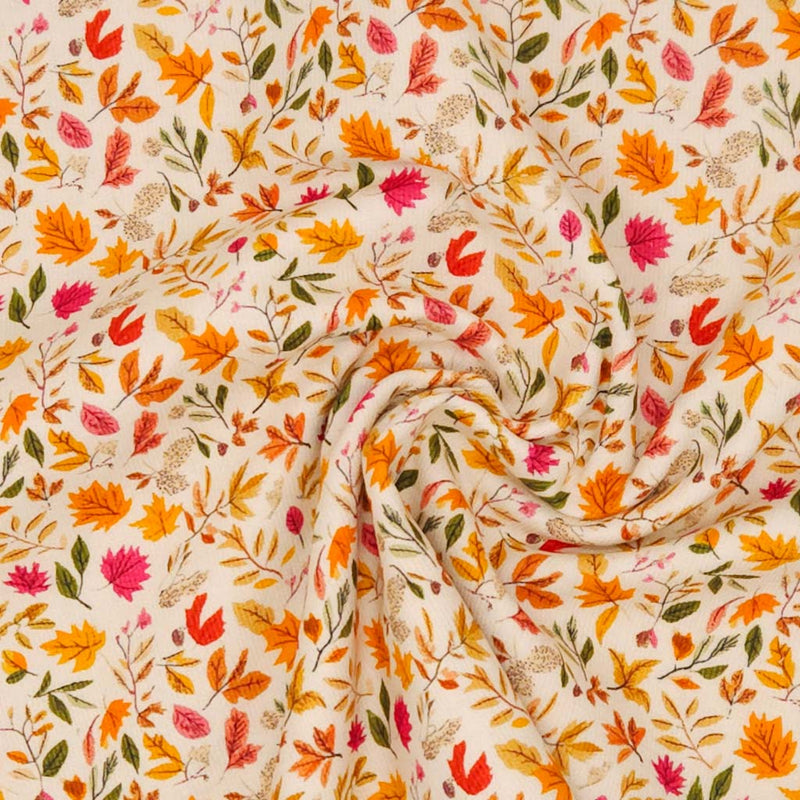 Fabric with autumn leaf pattern on a beige needlecord fabric
