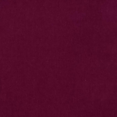 A wine coloured plain needlecord corduroy fabric