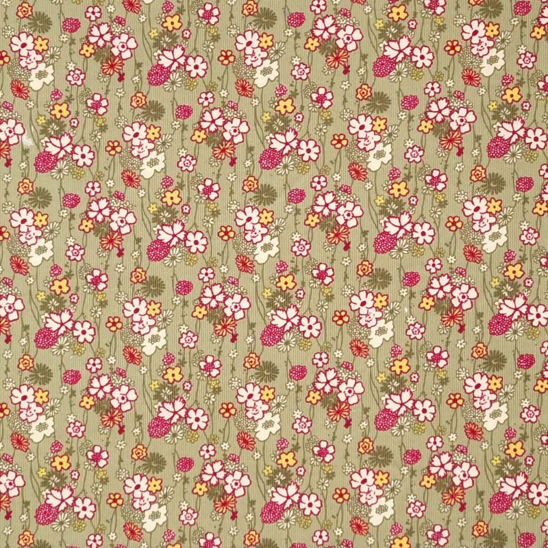 A retro floral design printed on a sage green cotton needlecord fabric