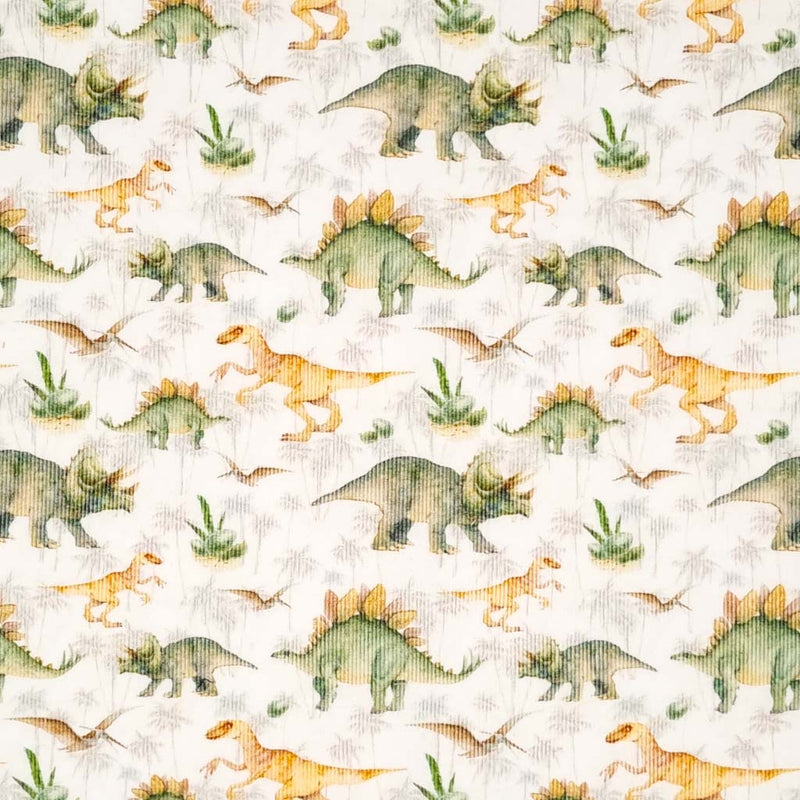 Dinosaurs printed on a white needlecord cotton fabric