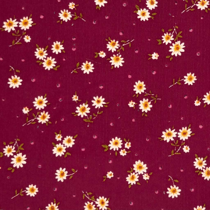 corduroy fabric featuring a cute, daisy and spots design is made from 100% cotton fibres.