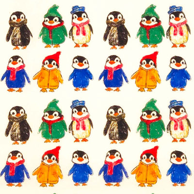 Collection of penguins in various outfits on a white cotton fabric