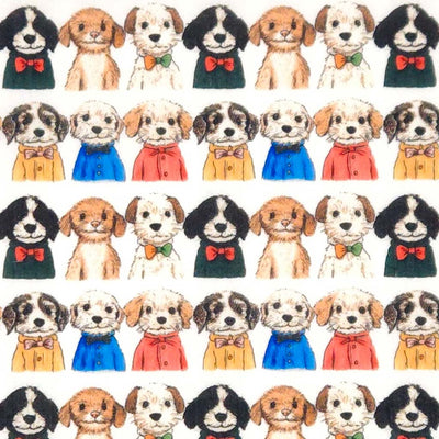 Pattern of small dogs wearing colourful outfits and bow ties on a white polycotton fabric