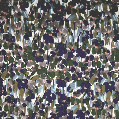 Pattern of abstract shapes in various colours on a white viscose fabric