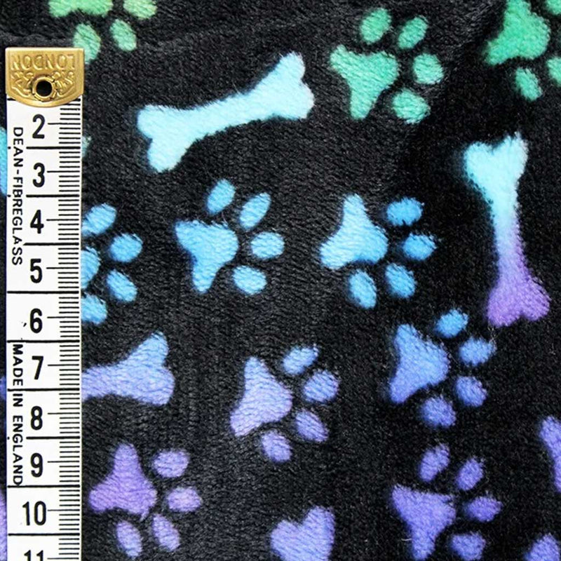 Rainbow coloured paw and bones printed on a black bubs cuddle fleece with a cm ruler