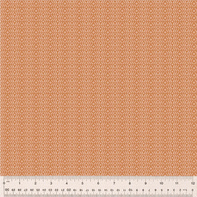 An orange geometric pattern printed on a cotton quilting fabric