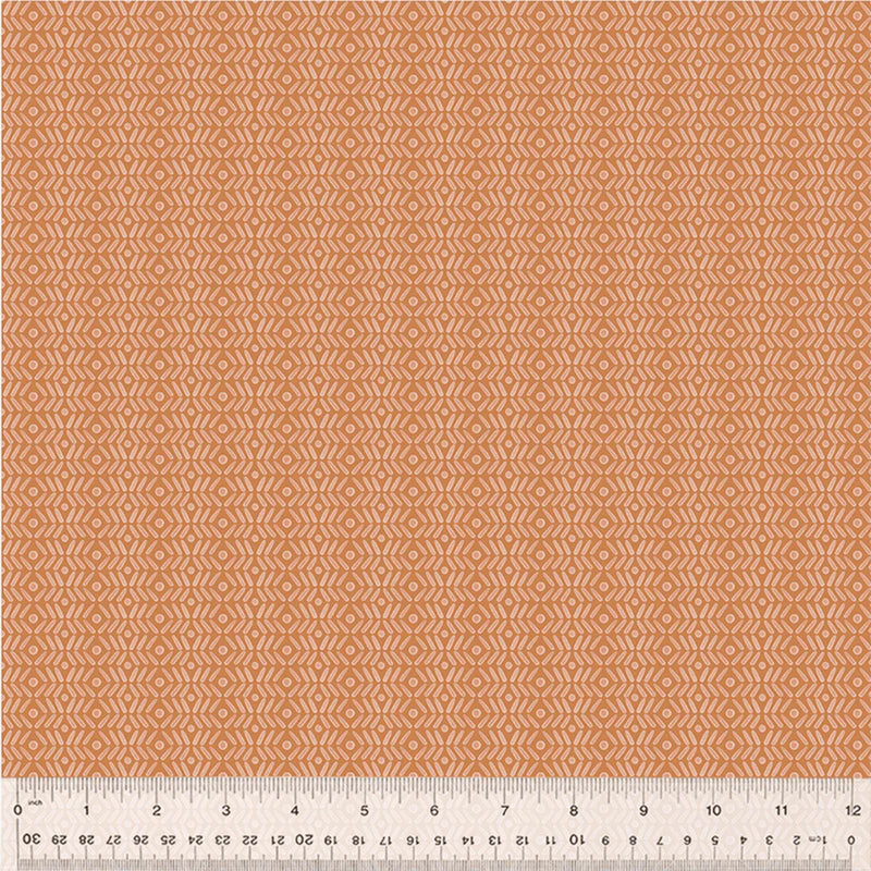 An orange geometric pattern printed on a cotton quilting fabric