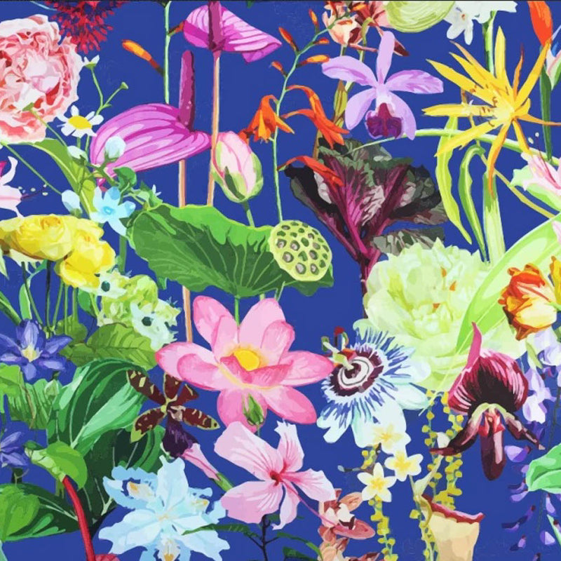 Vibrant summer flowers printed on a royal blue viscose fabric for dressmaking