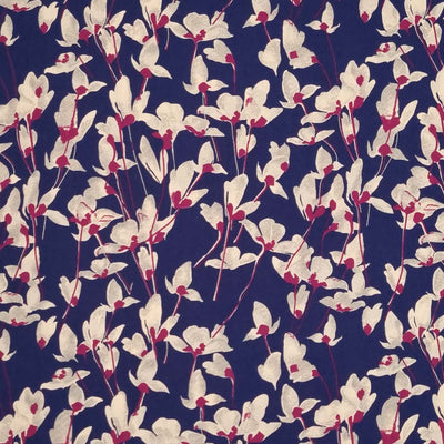 Ivory coloured petals are printed on a navy pima cotton lawn fabric