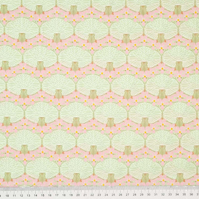 Mint coloured trees printed on a blush pink pima cotton lawn fabric with a cm ruler