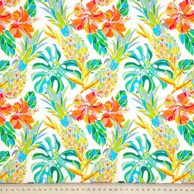 Pineapple and hibiscus printed on an ivory cotton poplin fabric with a cm ruler