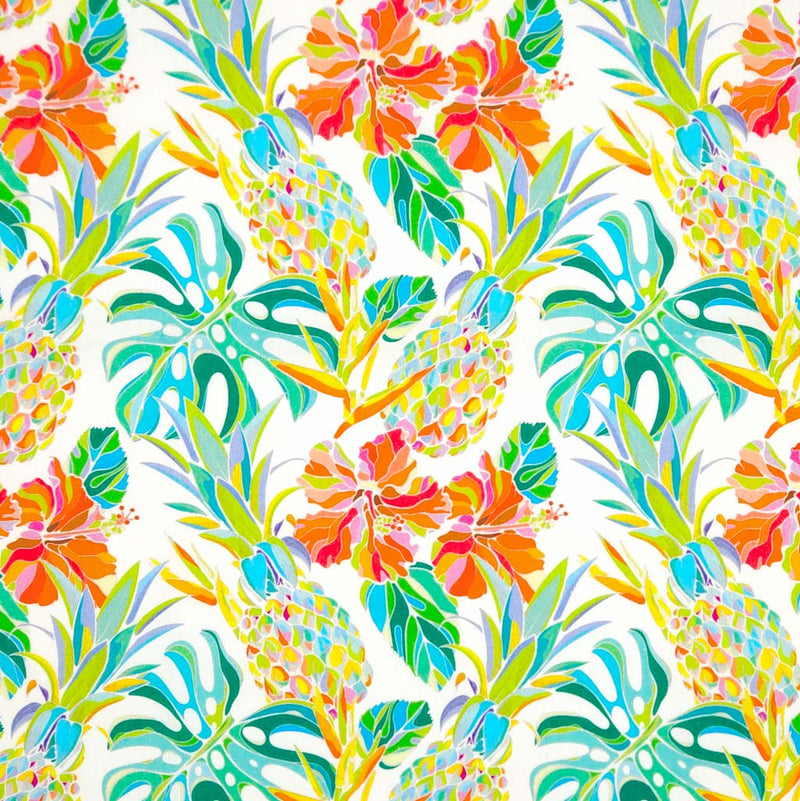 Pineapple and hibiscus printed on an ivory cotton poplin fabric