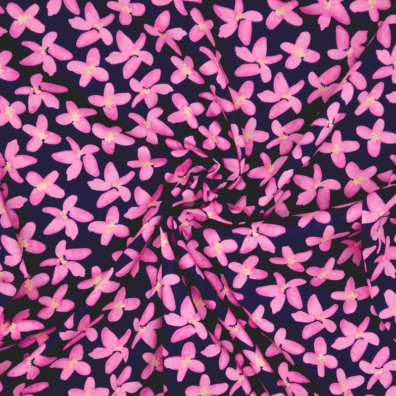 Fabric with pink floral pattern on a dark pima cotton lawn fabric
