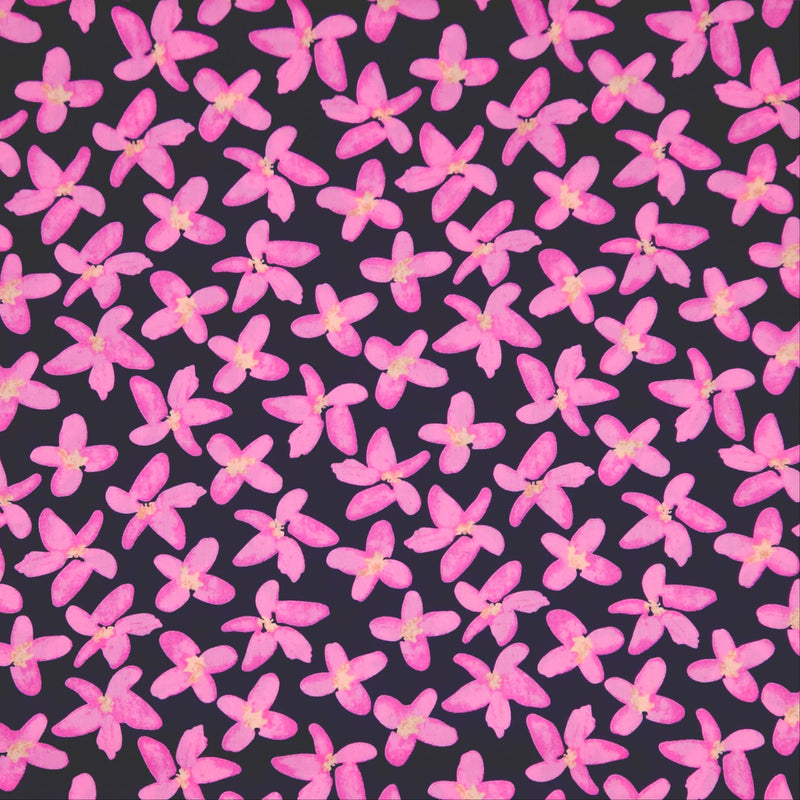 Pattern of pink flowers on a black pima cotton lawn fabric