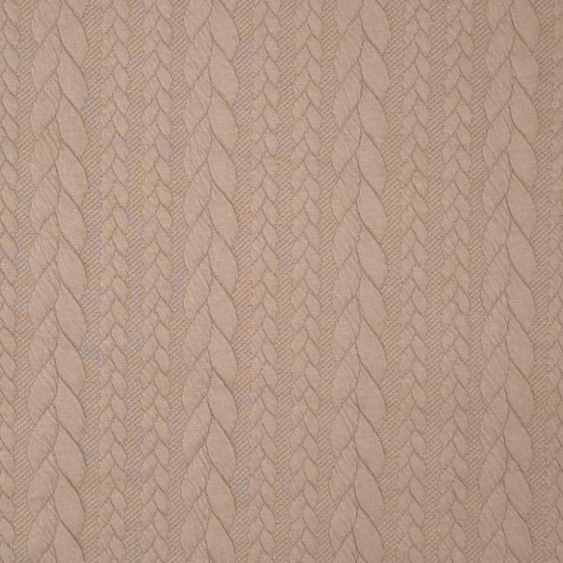 A plain sand coloured cable knit fabric