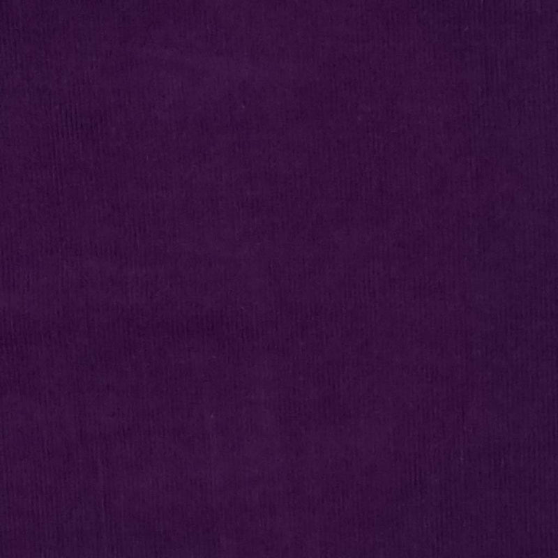 A plain aubergine coloured needlecord corduroy fabric