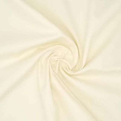 A cream plain cotton poplin fabric
