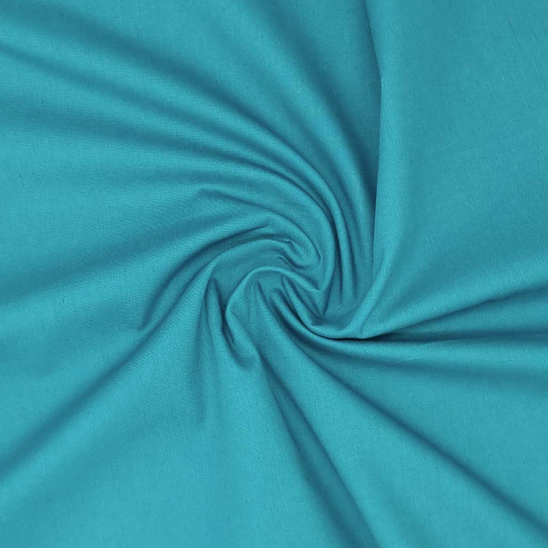 A plain teal cotton poplin fabric