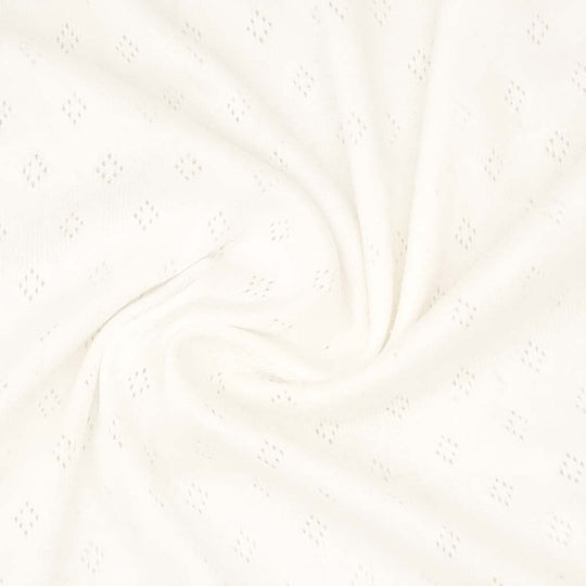 A pointelle stretch jersey fabric in cream