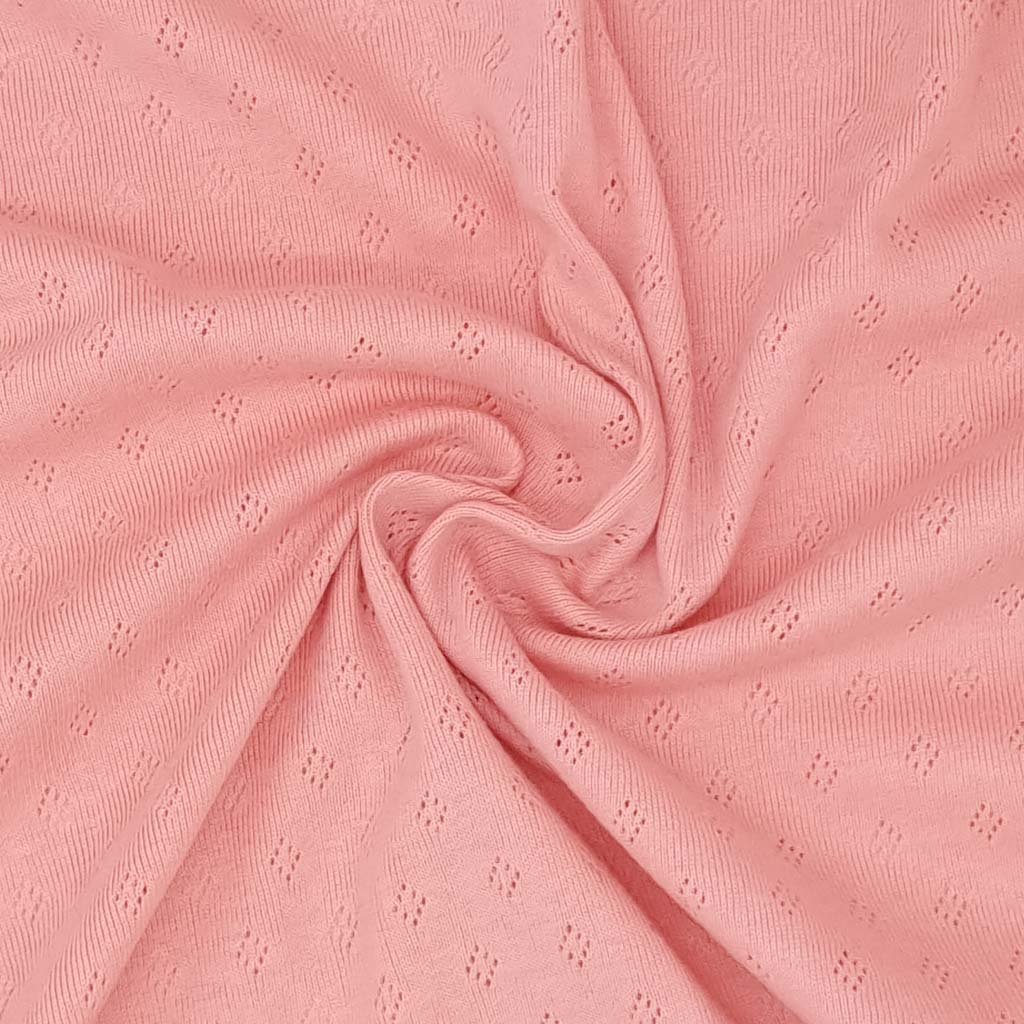 A pointelle stretch jersey fabric in rose pink