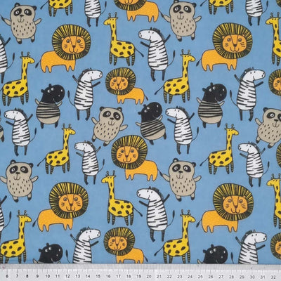 Jungle animals printed on an blue polycotton fabric with a cm ruler
