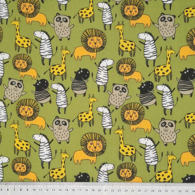 Jungle animals printed on an olive green polycotton fabric with a cm ruler