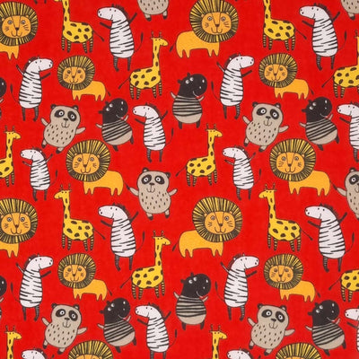 Jungle animals printed on an red polycotton fabric with a cm ruler