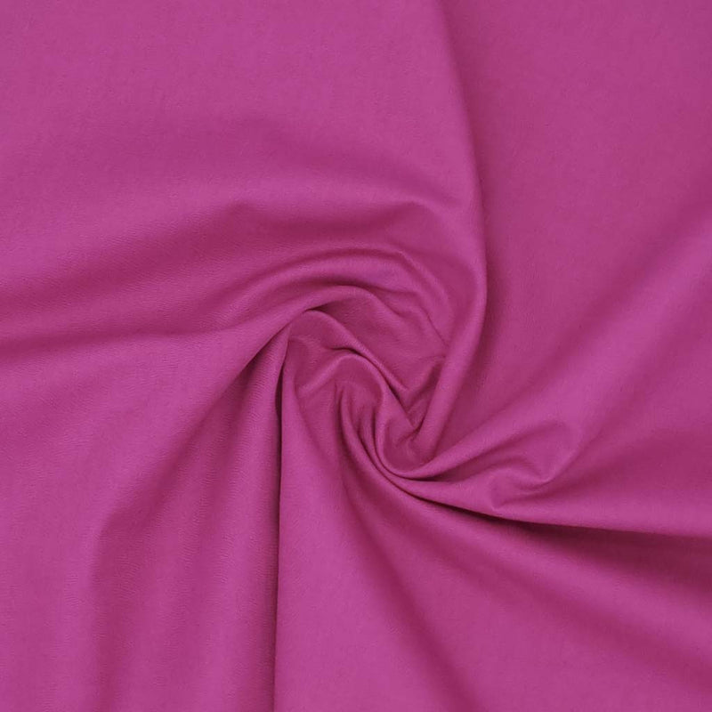 A plain magenta coloured polycotton fabric