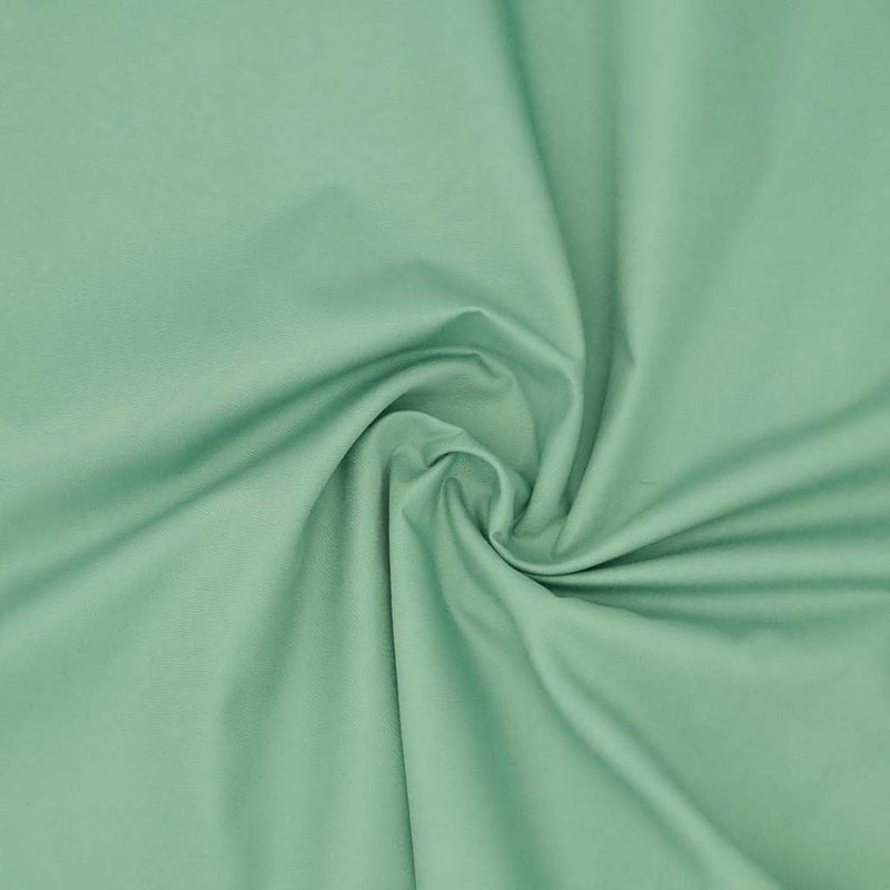 A plain, moss green coloured polycotton fabric