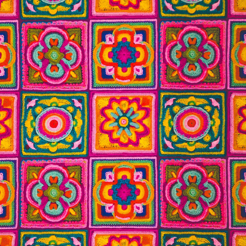 Colourful crochet pattern with geometric shapes and vibrant colours printed on a cotton fabric