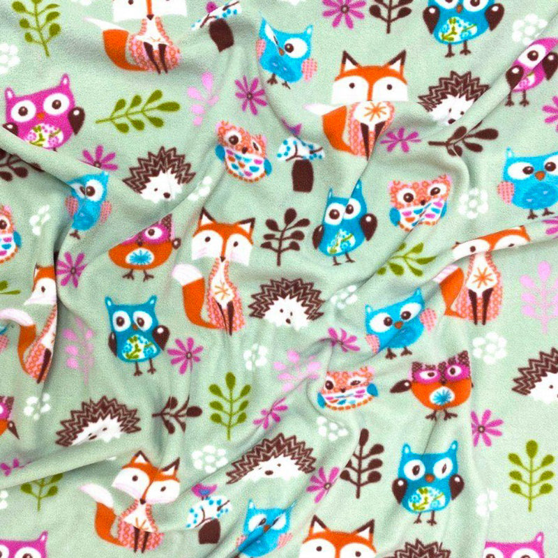 Woodland animals printed on a sage green polar fleece fabric