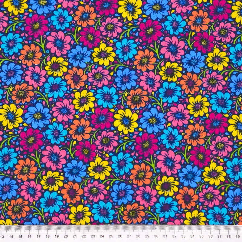 Colourful floral pattern on a fabric swatch with a ruler at the bottom.