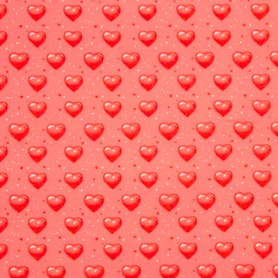 Pattern of red hearts on a pink polycotton fabric